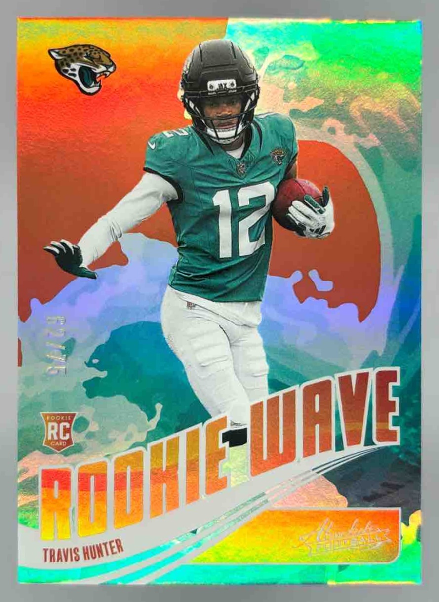 Card image for 2025 Panini Absolute Travis Hunter Rookie Wave Spectrum Orange /75 #18 RC Jaguars