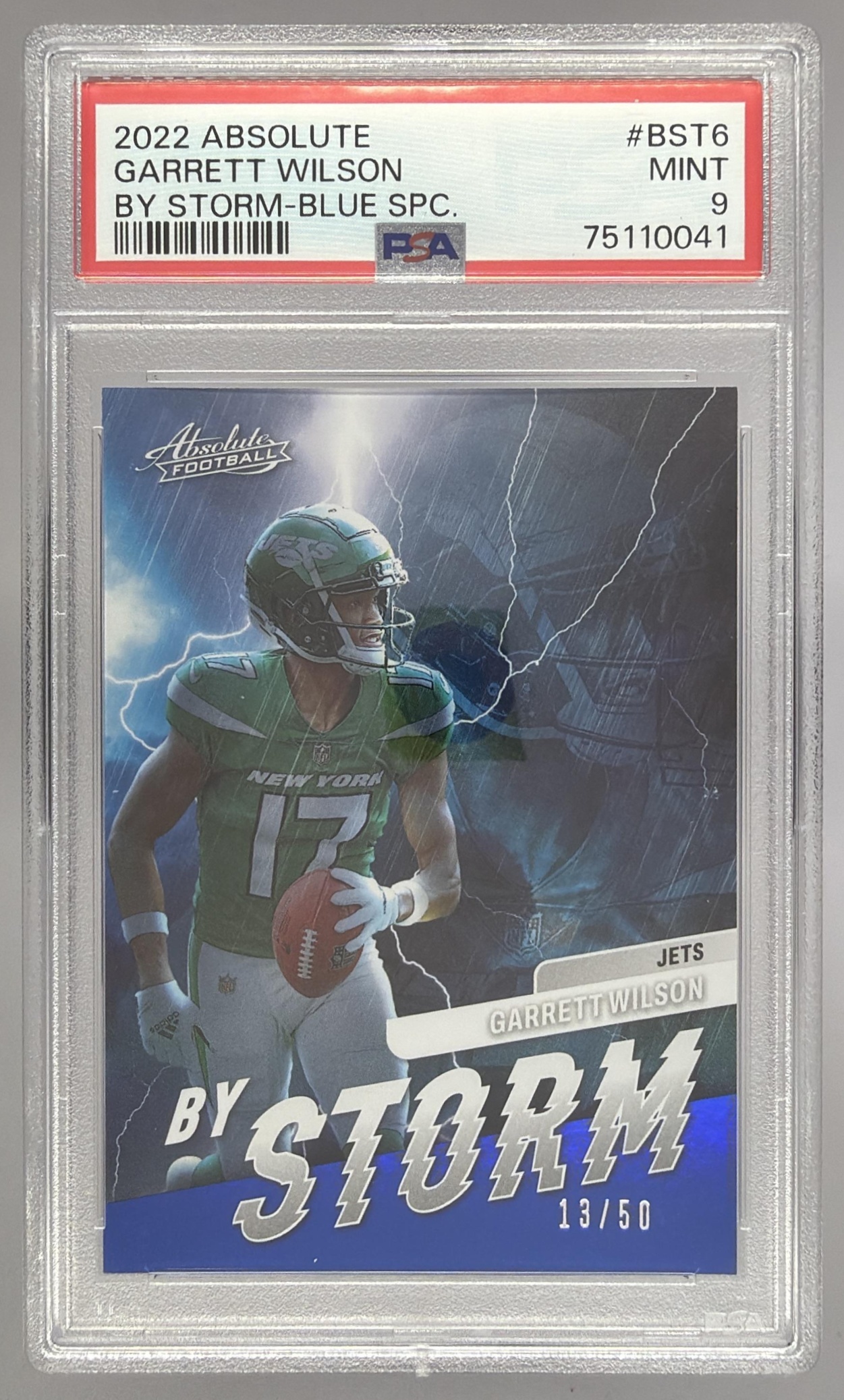Card image for 2022 Panini Absolute Garrett Wilson By Storm Spectrum Blue /50 #BST-6 RC Jets
