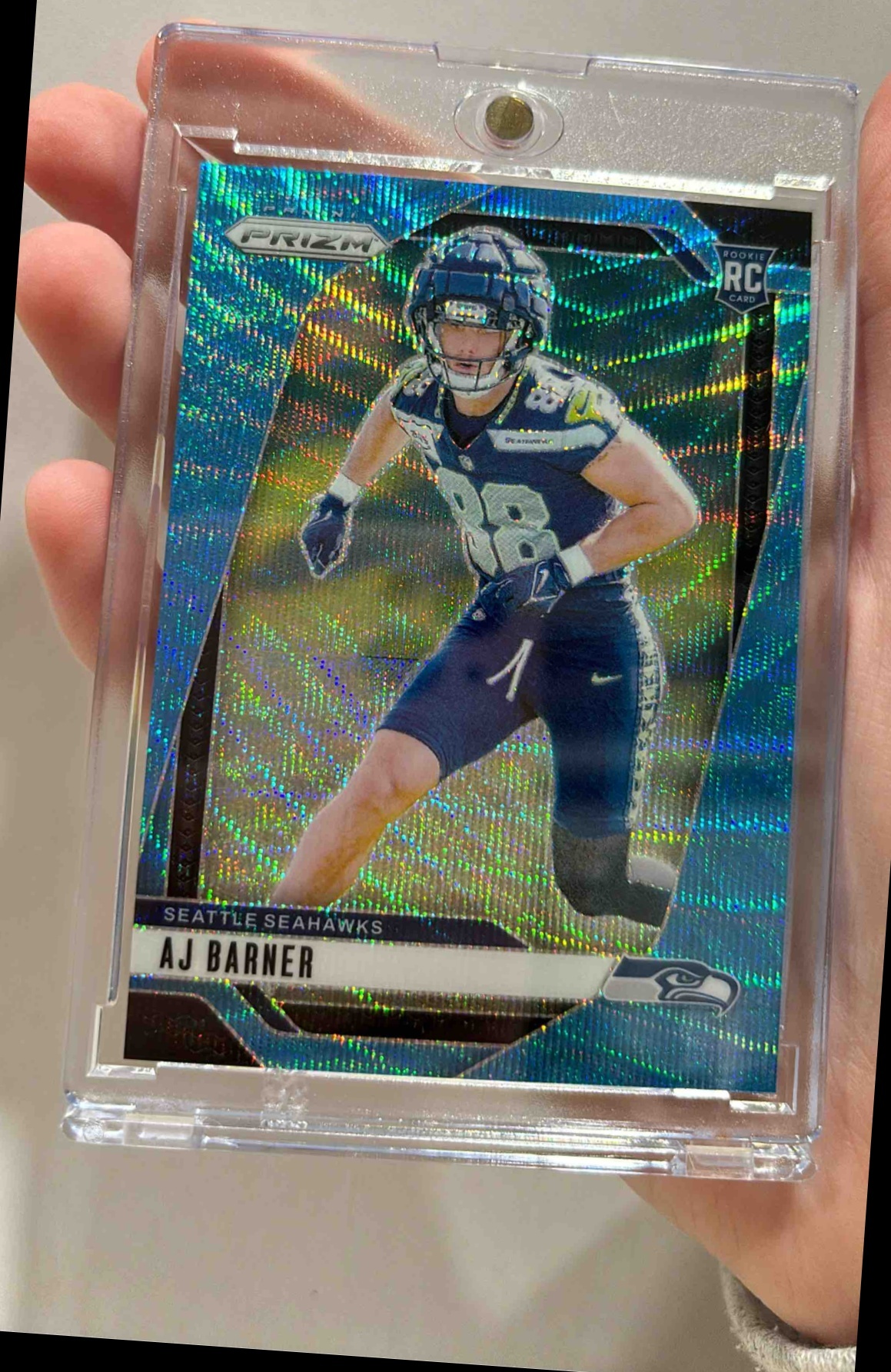 Card image for 2024 Panini Football Prizm AJ Barner Blue Wave /230 #304 RC Seattle Seahawks