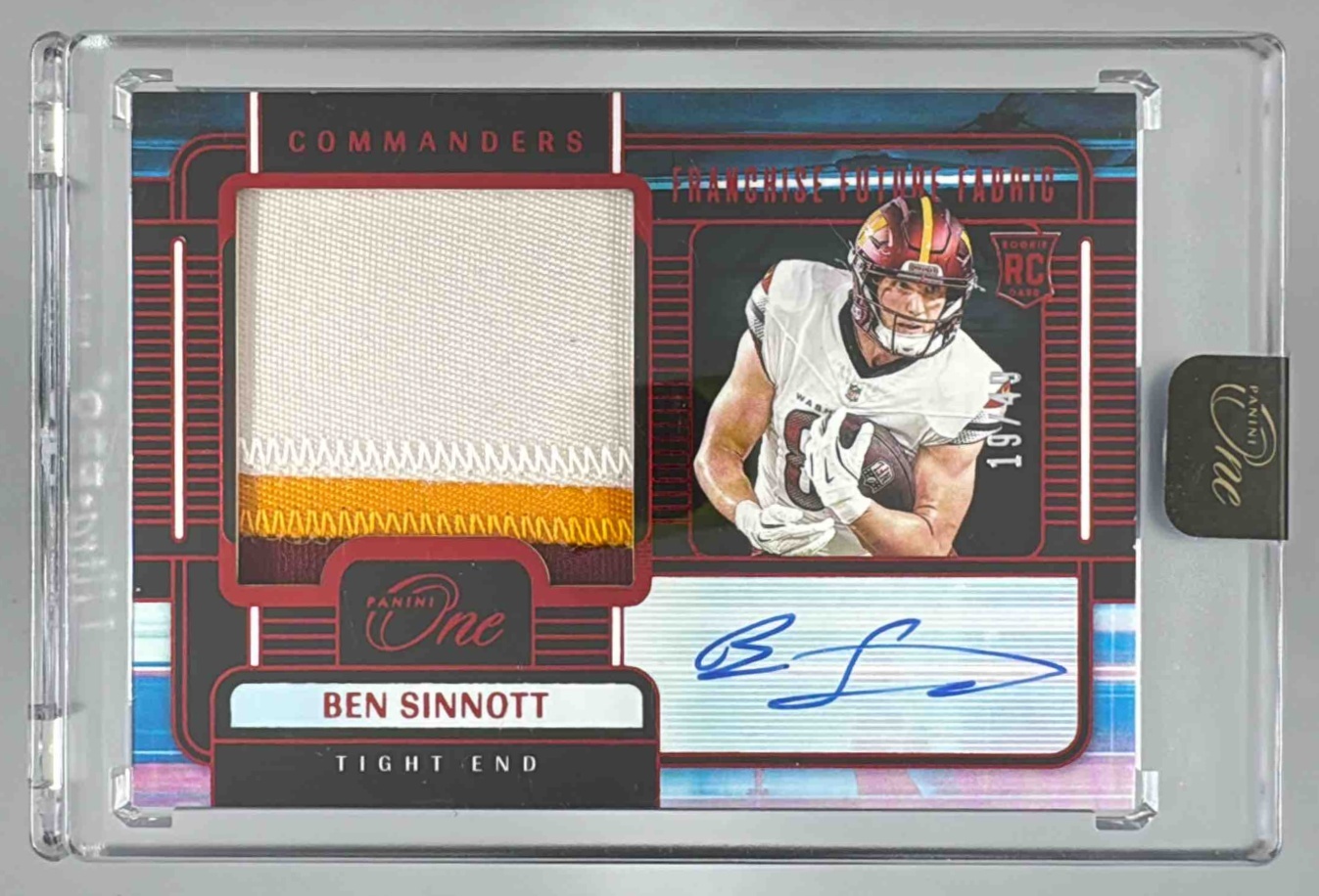 Card image for 2024 Panini One Ben Sinnott Franchise Future Fabric Auto Red /49 #99 MEM RC Commanders