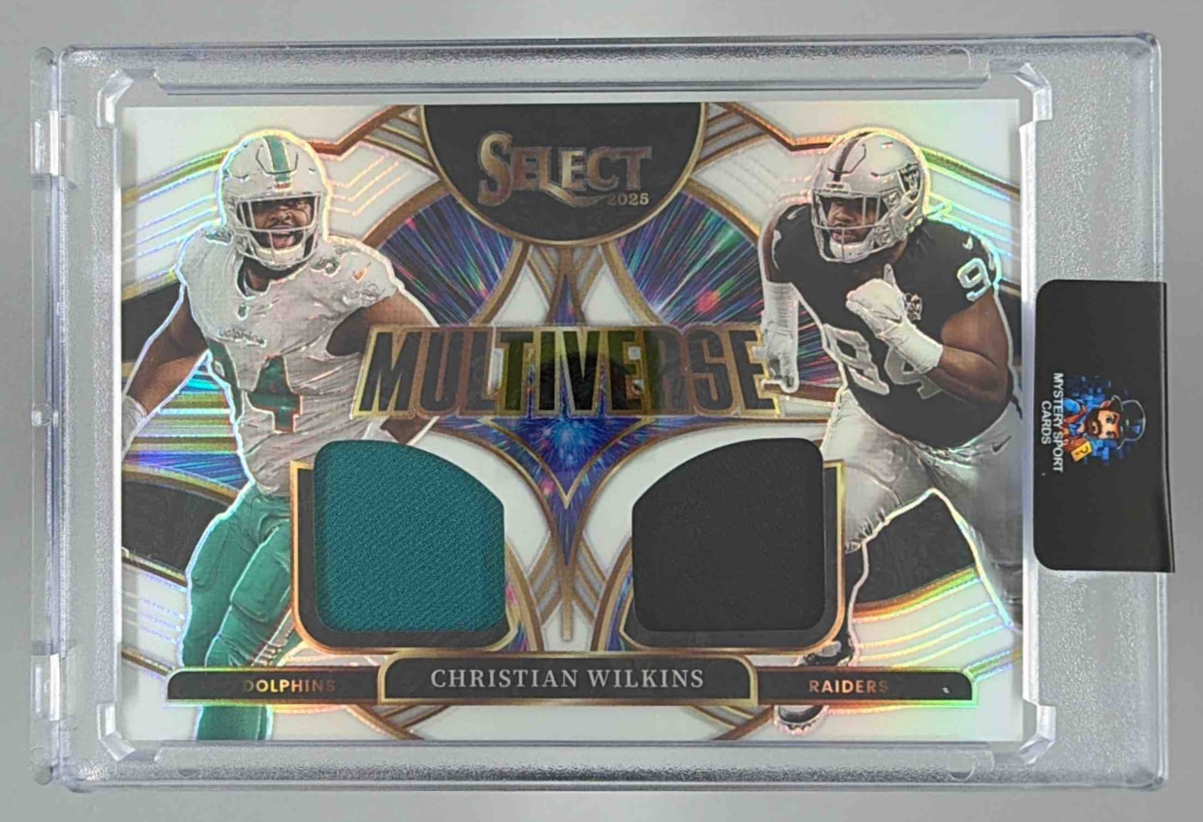Card image for 2025 Panini Select Christian Wilkins Multiverse Jerseys White Prizm /99 #MVJ-CWS