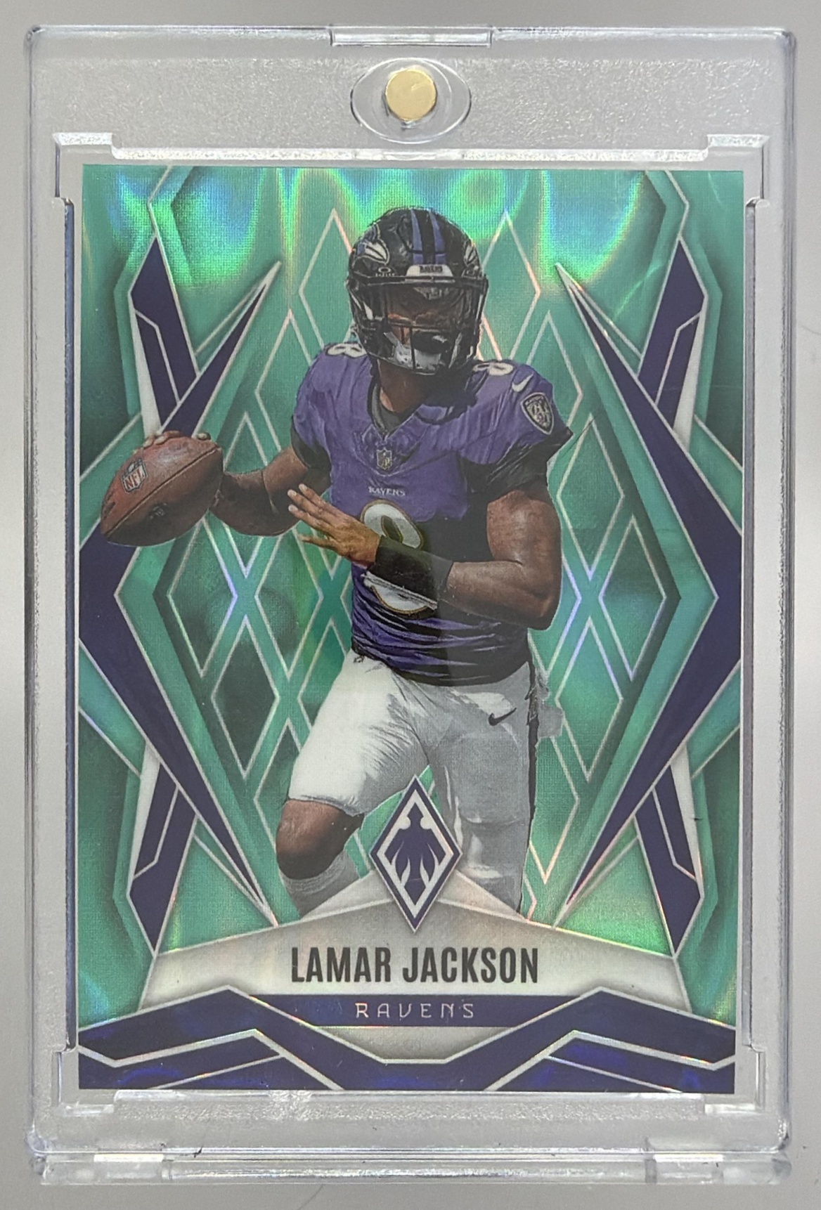 Card image for 2025 Panini Phoenix Lamar Jackson Teal Lava Prizm /175 #144 Ravens