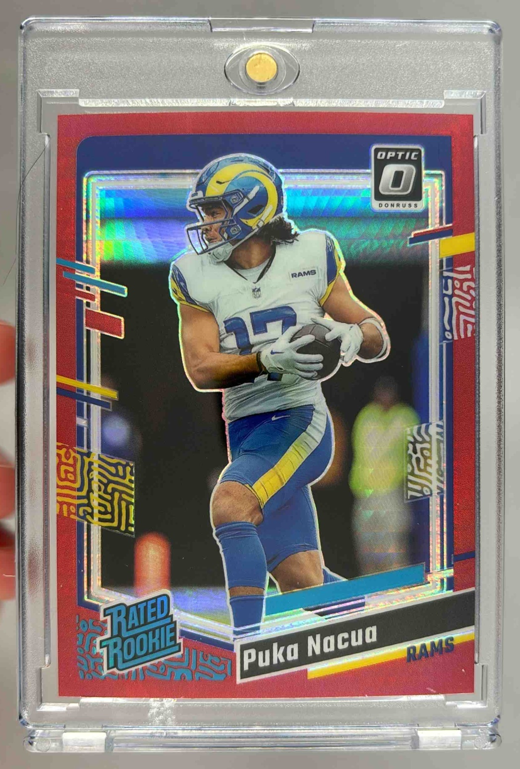 Card image for 2023 Panini Donruss Optic Puka Nacua Red Mojo Prizm #238 RC Rated Rookie Rams