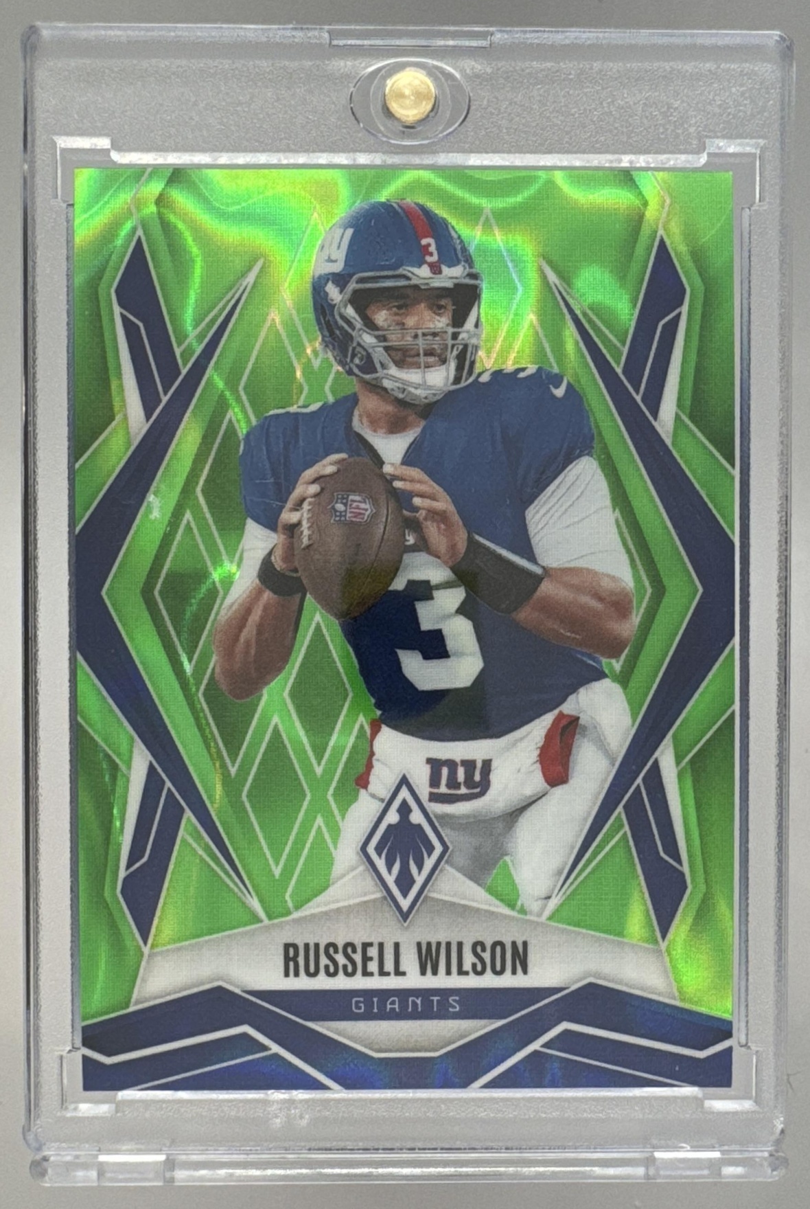 Card image for 2025 Panini Phoenix Russell Wilson Lime Green Lava Prizm /225 #28 Giants