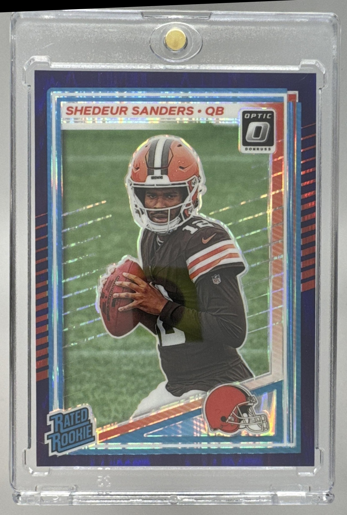 Card image for 2025 Panini Donruss Optic Shedeur Sanders Rated Rookie Purple Shock Prizm #203 Browns