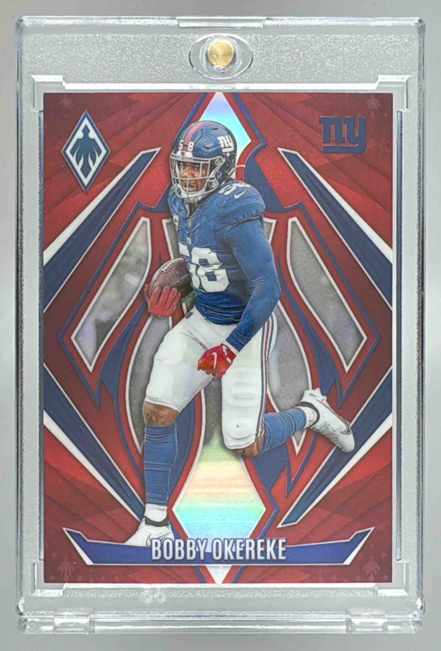 Card image for 2024 Panini Football Phoenix Bobby Okereke Red /99 #13 New York Giants