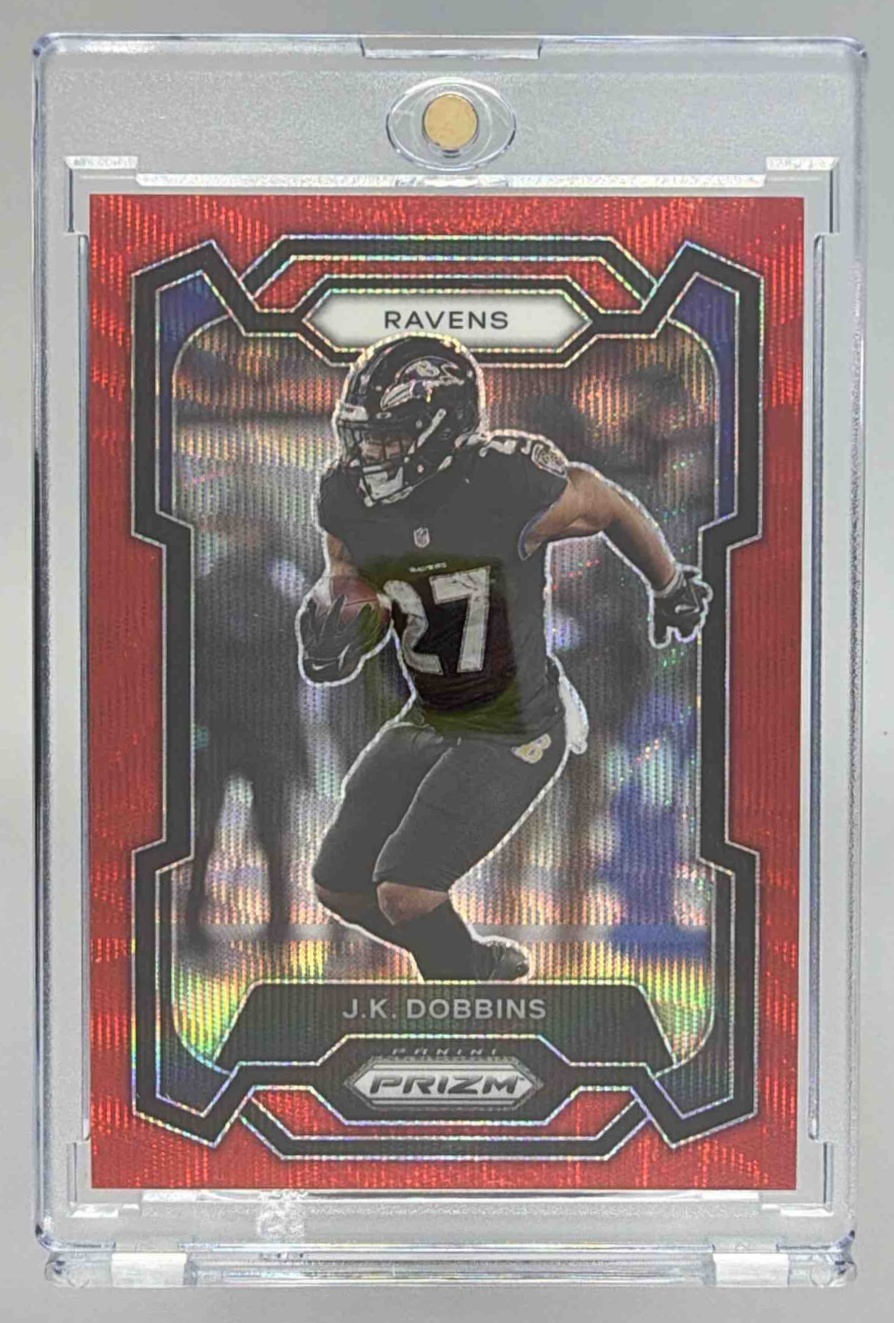 Card image for 2023 Panini Football Prizm J.K. Dobbins Red Wave /149 #26 Baltimore Ravens