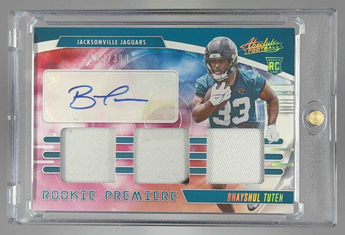 Card image for 2025 Panini Absolute Bhayshul Tuten Rookie Premiere Materials Autos /399 #RPM-BTN MEM RC Auto Jaguars
