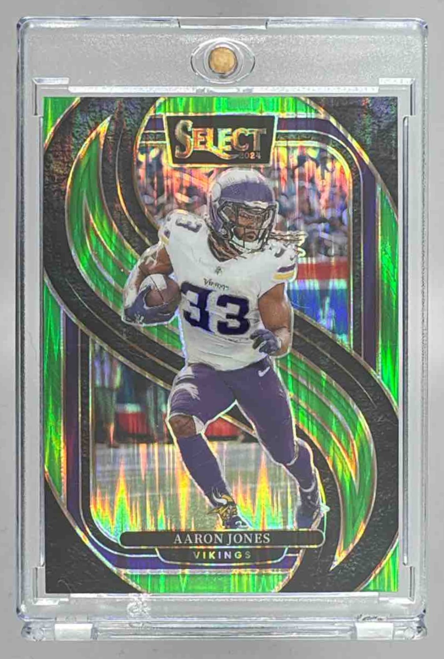 Card image for 2024 Panini Select Aaron Jones Premier Neon Green Prizm Shock /499 #102 Vikings