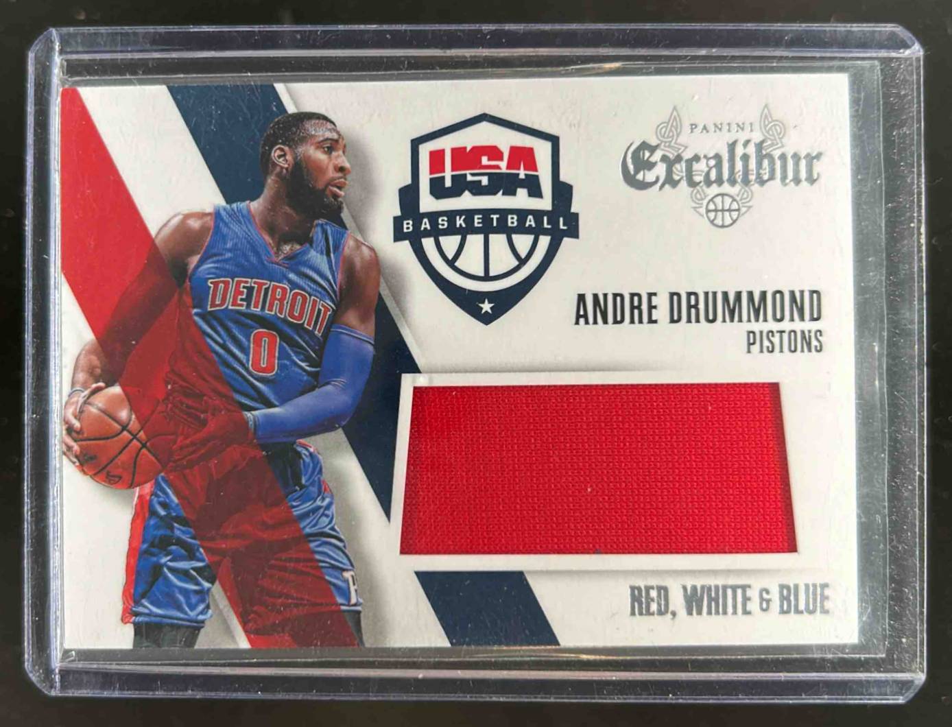 Card image for 2014-15 PANINI EXCALIBUR ANDRE DRUMMOND RED, WHITE & BLUE #5 DETROIT PISTONS