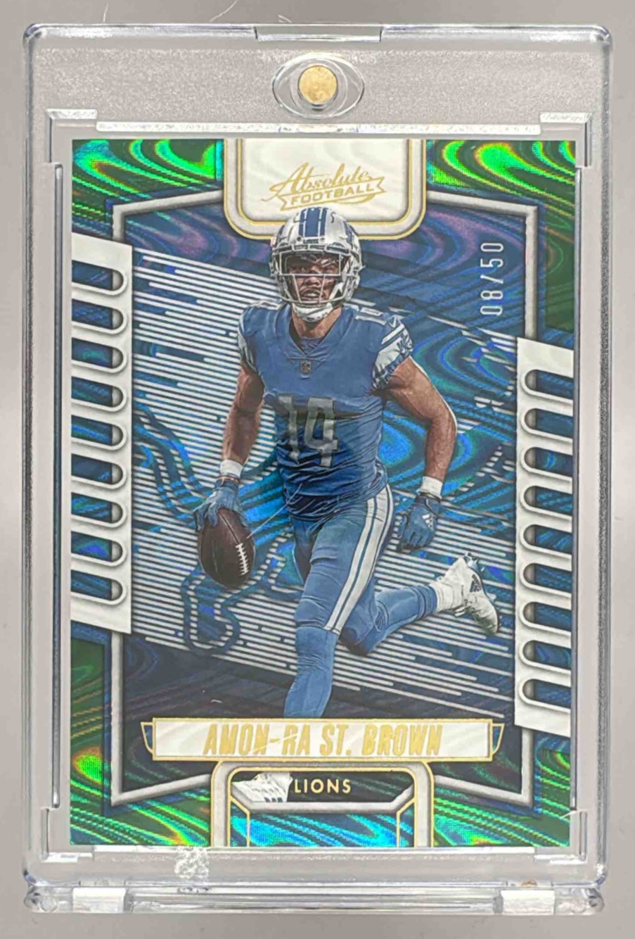 Card image for 2023 Panini Absolute Amon-Ra St. Brown Spectrum Blue /50 #94 Lions