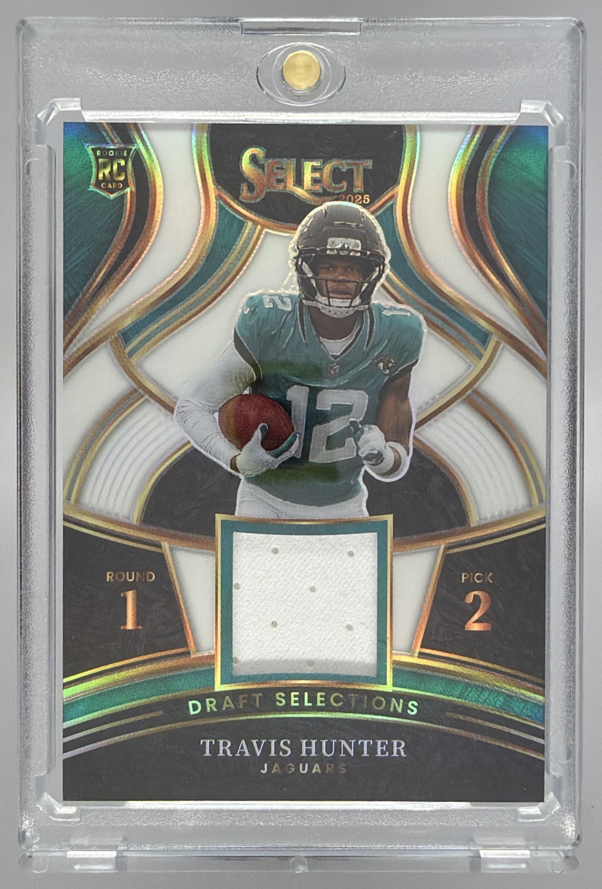 Card image for 2025 Panini Select Travis Hunter Draft Selections Memorabilia White Prizm /99 #DSM-THR MEM RC Jaguars