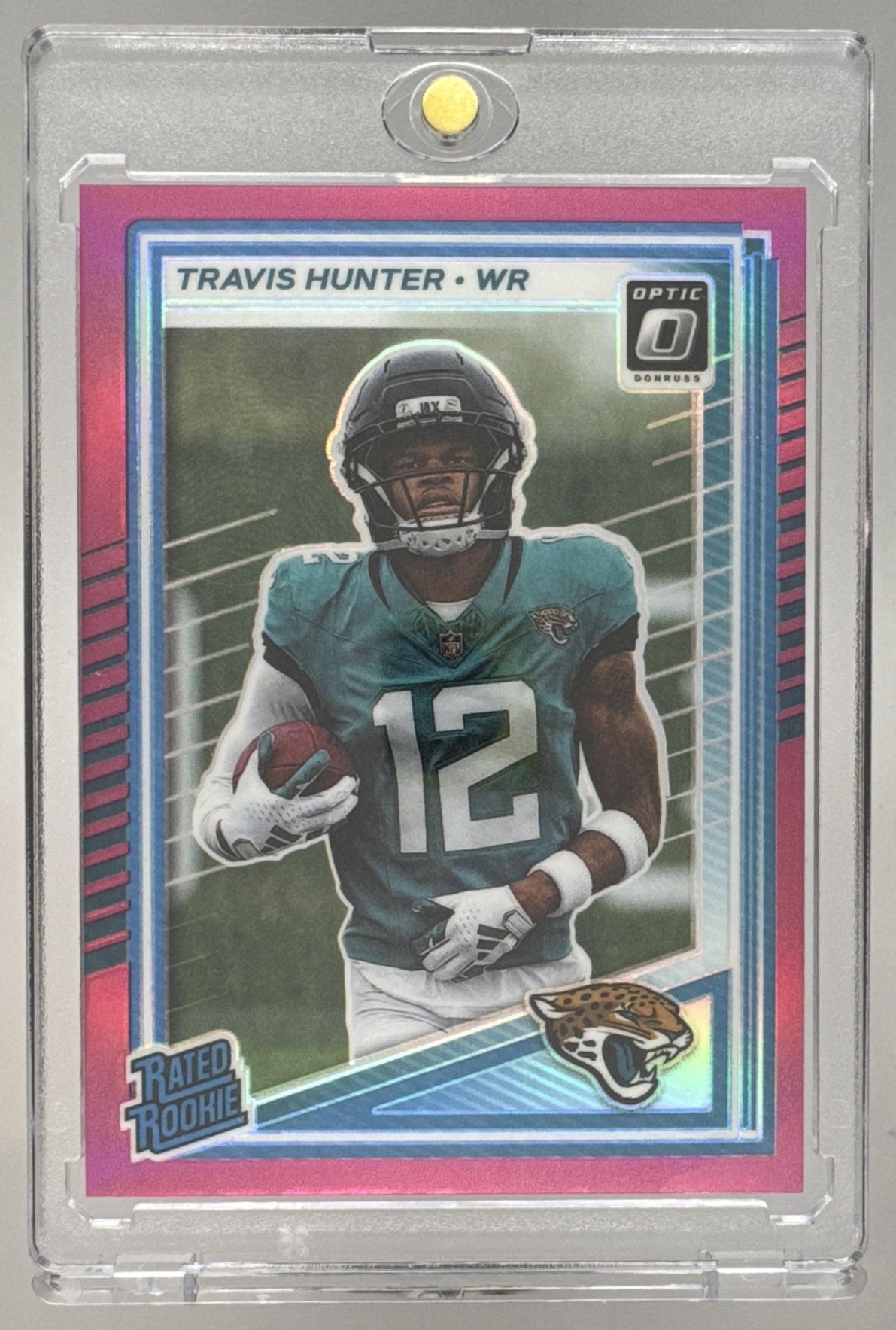 Card image for 2025 Panini Donruss Optic Travis Hunter Rated Rookie Pink Prizm #201 Jaguars