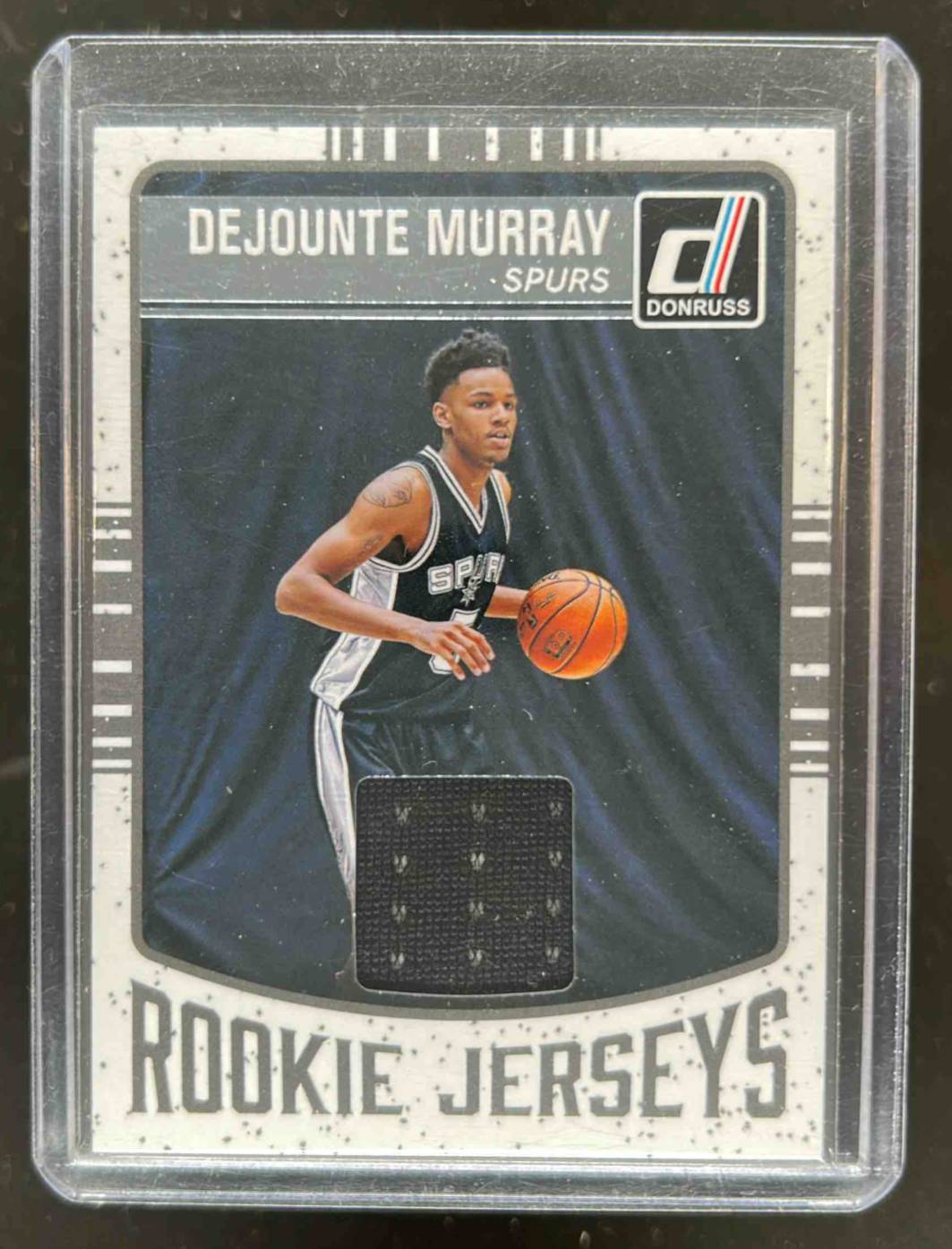 Card image for 2016-17 PANINI DONRUSS DEJOUNTE MURRAY ROOKIE JERSEYS #54 RC SAN ANTONIO SPURS