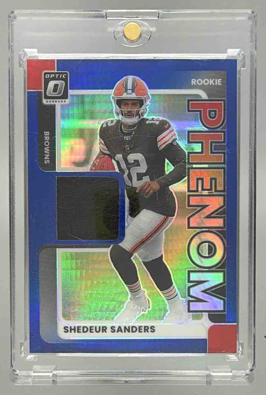 Card image for 2025 Panini Donruss Optic Shedeur Sanders Rookie Phenoms Blue Hyper Prizm #RPBH-SSS MEM RC Browns