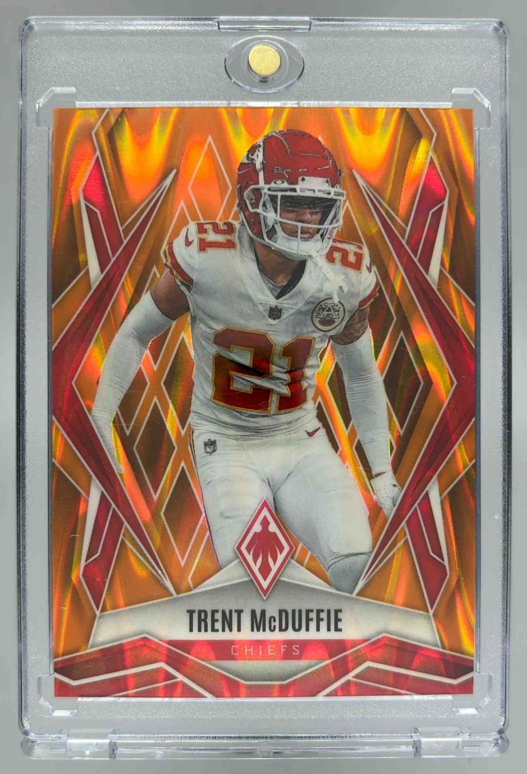 Card image for 2025 Panini Phoenix Trent McDuffie Orange Seismic /20 #91 Chiefs