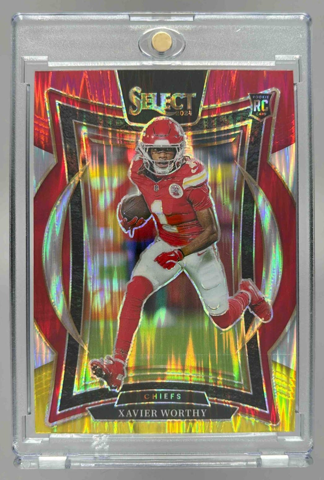 Card image for 2024 Panini Select Xavier Worthy Concourse Red and Yellow Prizm Shock #32 RC Chiefs
