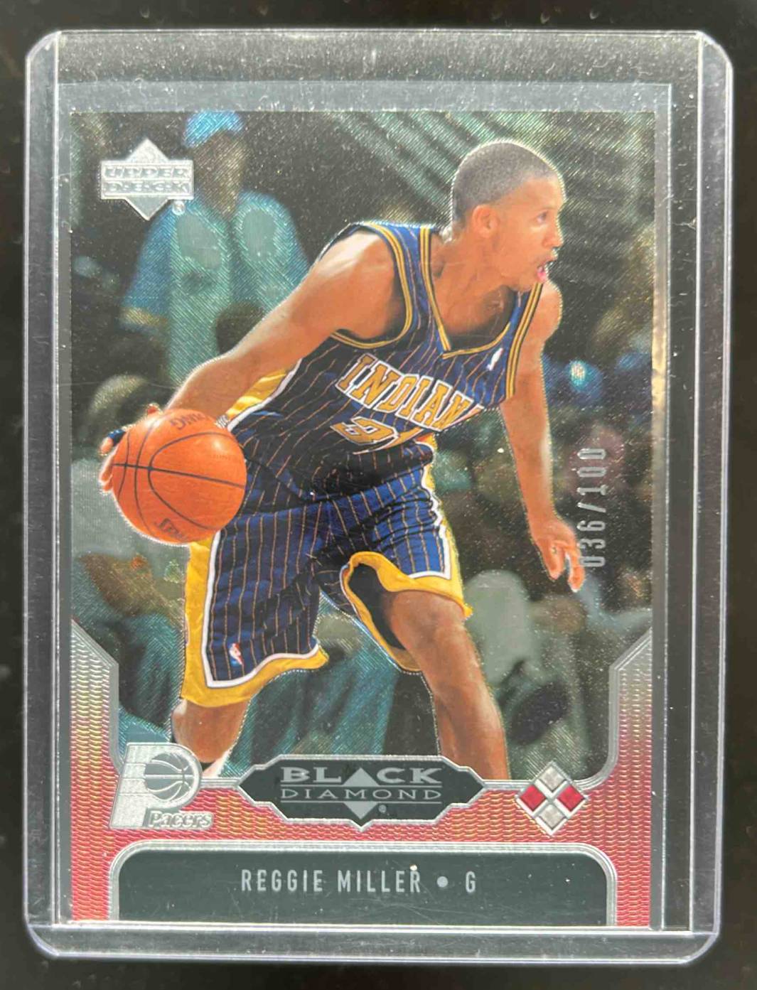 Card image for 2004-05 UPPER DECK BLACK DIAMOND REGGIE MILLER RED /100 #99 INDIANA PACERS