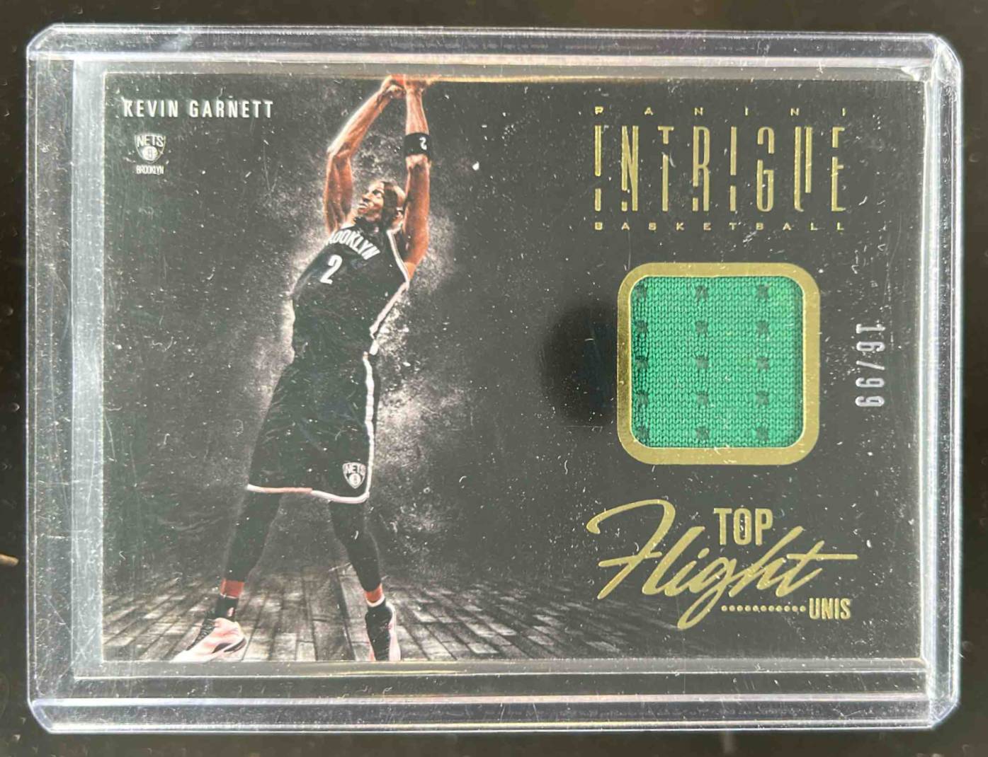 Card image for 2013-14 PANINI INTRIGUE KEVIN GARNETT #7 TOP FLIGHT UNIS 16/99 BROOKLYN NETS