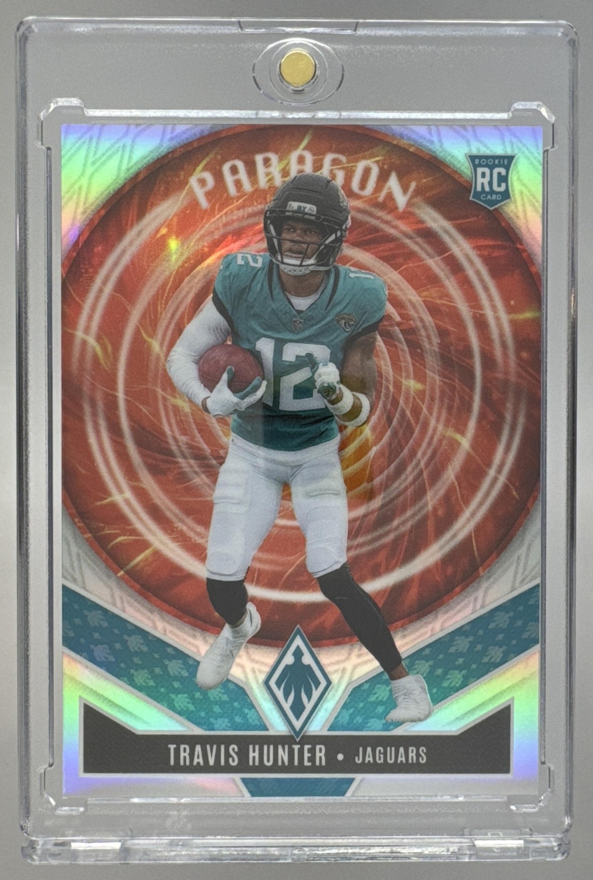 Card image for 2025 Panini Football Phoenix Travis Hunter Paragon #12 RC Jacksonville Jaguars