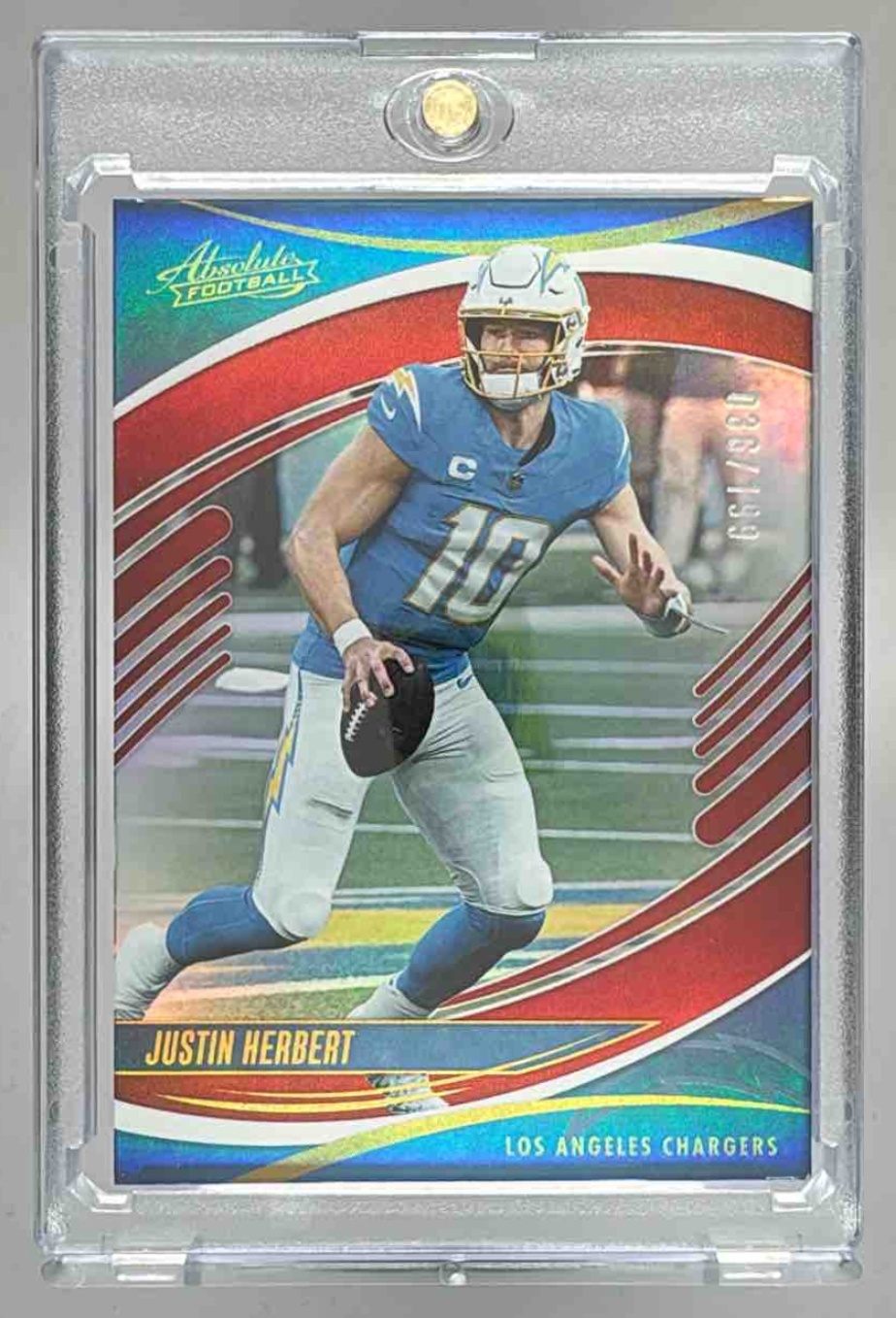 Card image for 2025 Panini Absolute Justin Herbert Spectrum Red /199 #11 Chargers