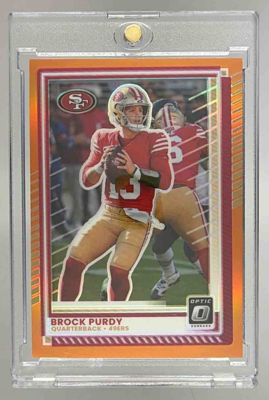 Card image for 2025 Panini Donruss Optic Brock Purdy Orange Prizm /299 #38 49ers