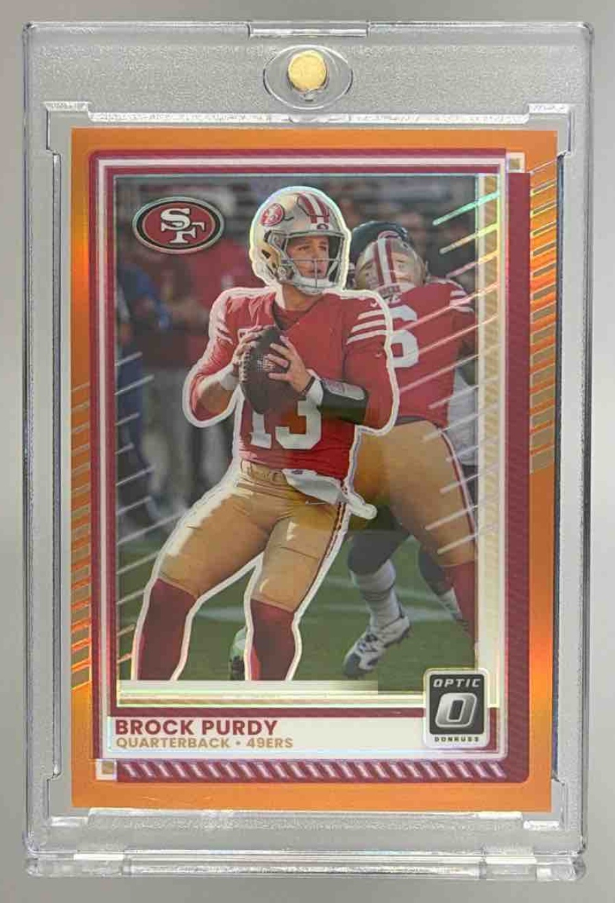 Card image for 2025 Panini Donruss Optic Brock Purdy Orange Prizm /299 #38 49ers
