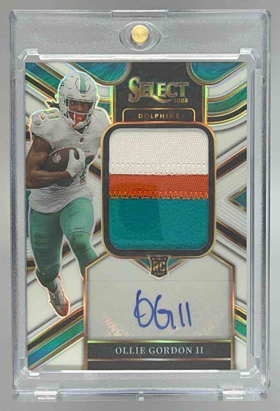 Card image for 2025 Panini Select Ollie Gordon II Jumbo Rookie Signature Swatch White Prizm /75 #JRS-OGN MEM RC Auto Dolphins