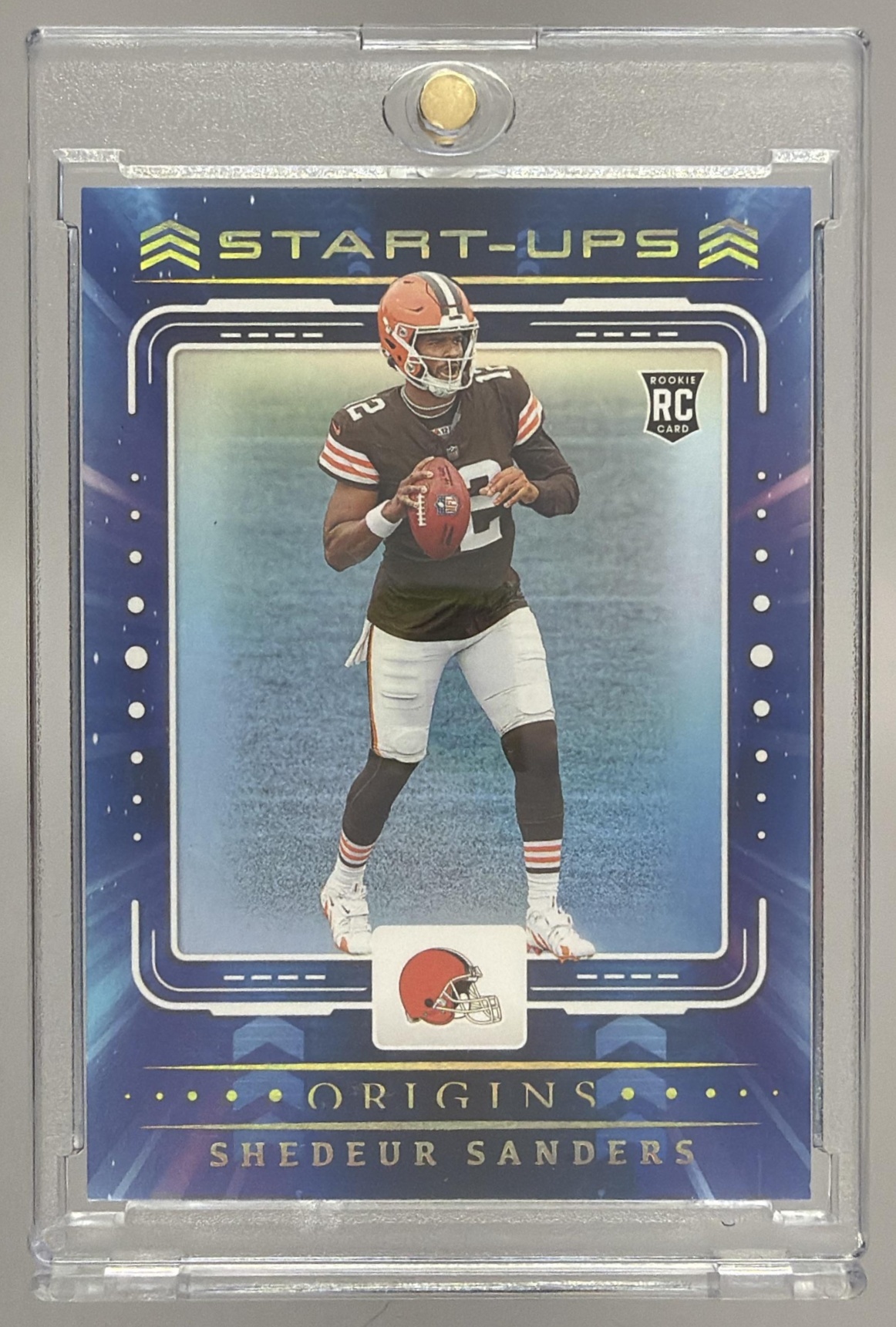 Card image for 2025 Panini Football Origins Shedeur Sanders Start-Ups #15 RC Cleveland Browns