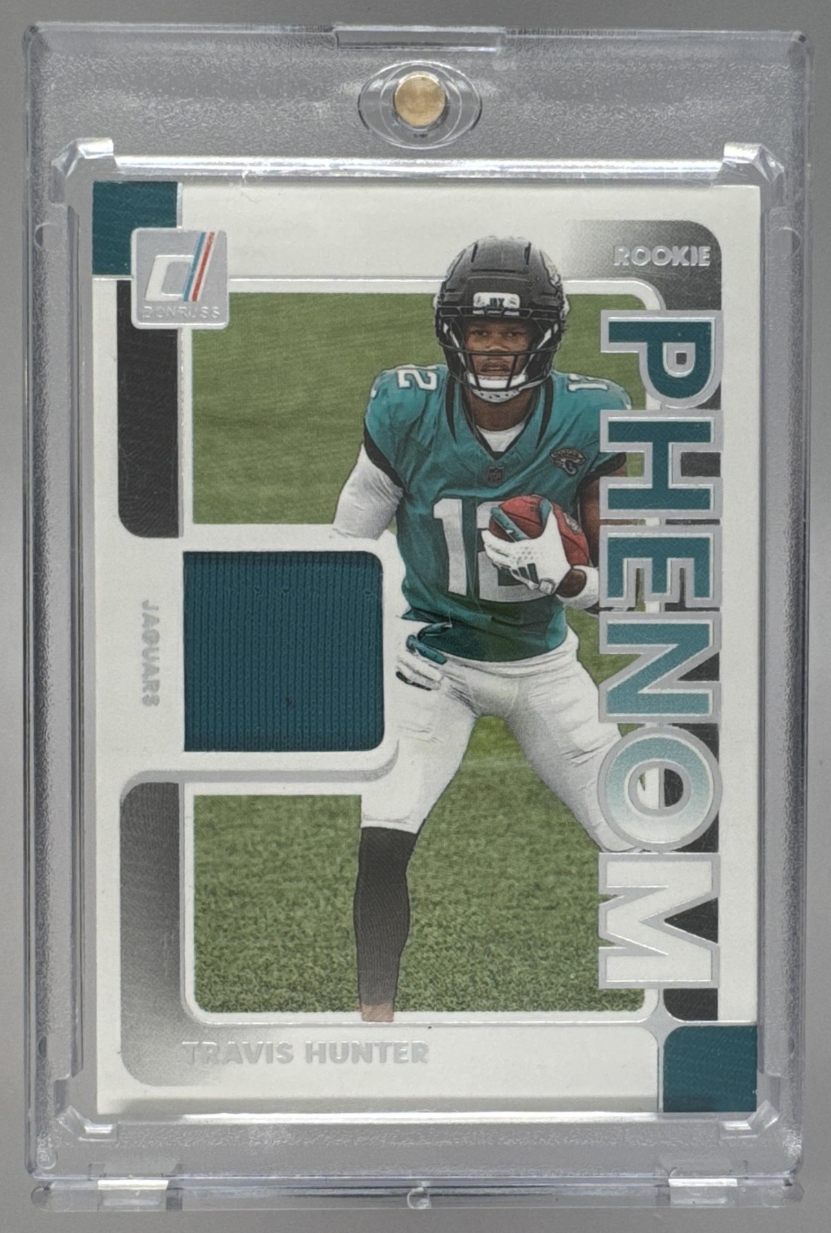 Card image for 2025 Panini Donruss Travis Hunter Rookie Phenom Jerseys #RPJ-THR MEM RC Jaguars
