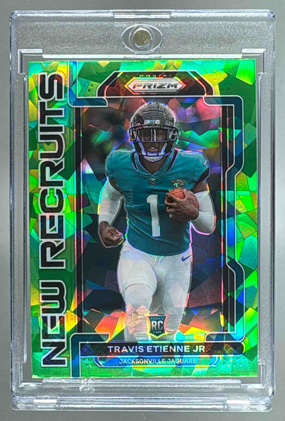 Card image for 2021 Panini Prizm Travis Etienne Jr. New Recruits Prizms Green #NR-9 RC Jaguars