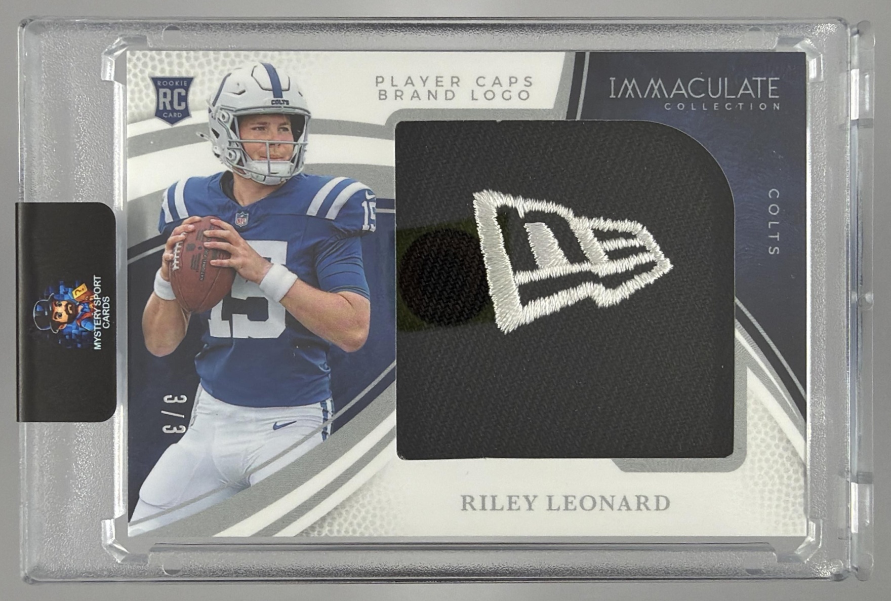 Card image for 2025 Panini Immaculate Collection Riley Leonard Rookie Player Caps Brand Logo /3 #28 MEM RC Colts