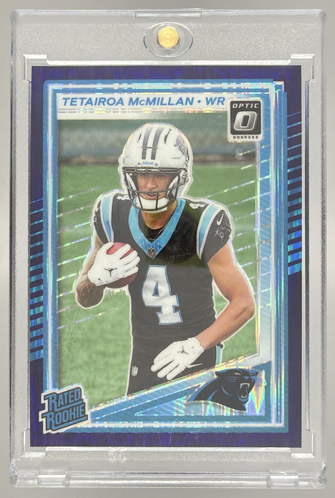 Card image for 2025 Panini Donruss Optic Tetairoa McMillan Rated Rookie Blue Hyper Prizm #209 Panthers