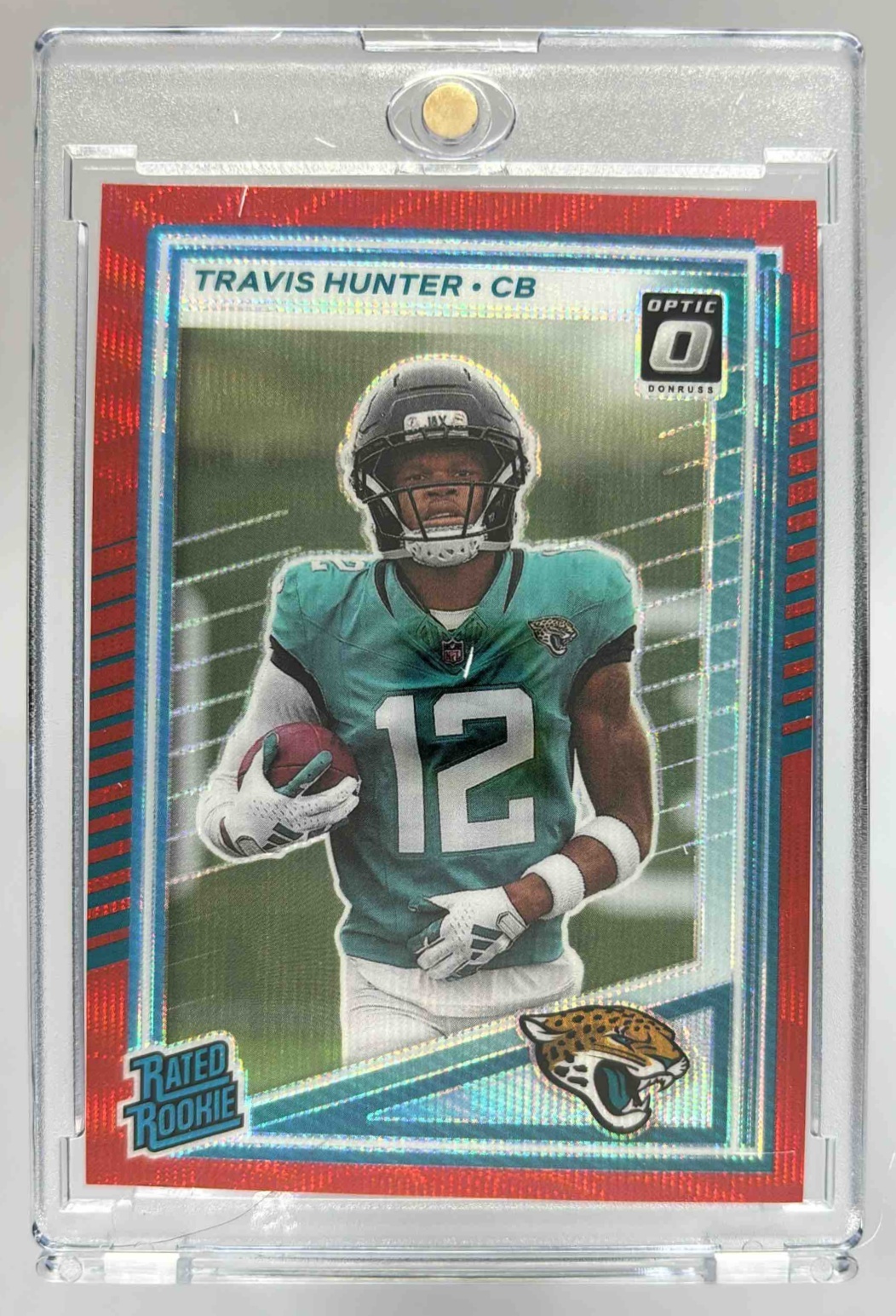 Card image for 2025 Panini Donruss Travis Hunter Optic Rated Rookie Preview Red Pandora #301 RC Jaguars