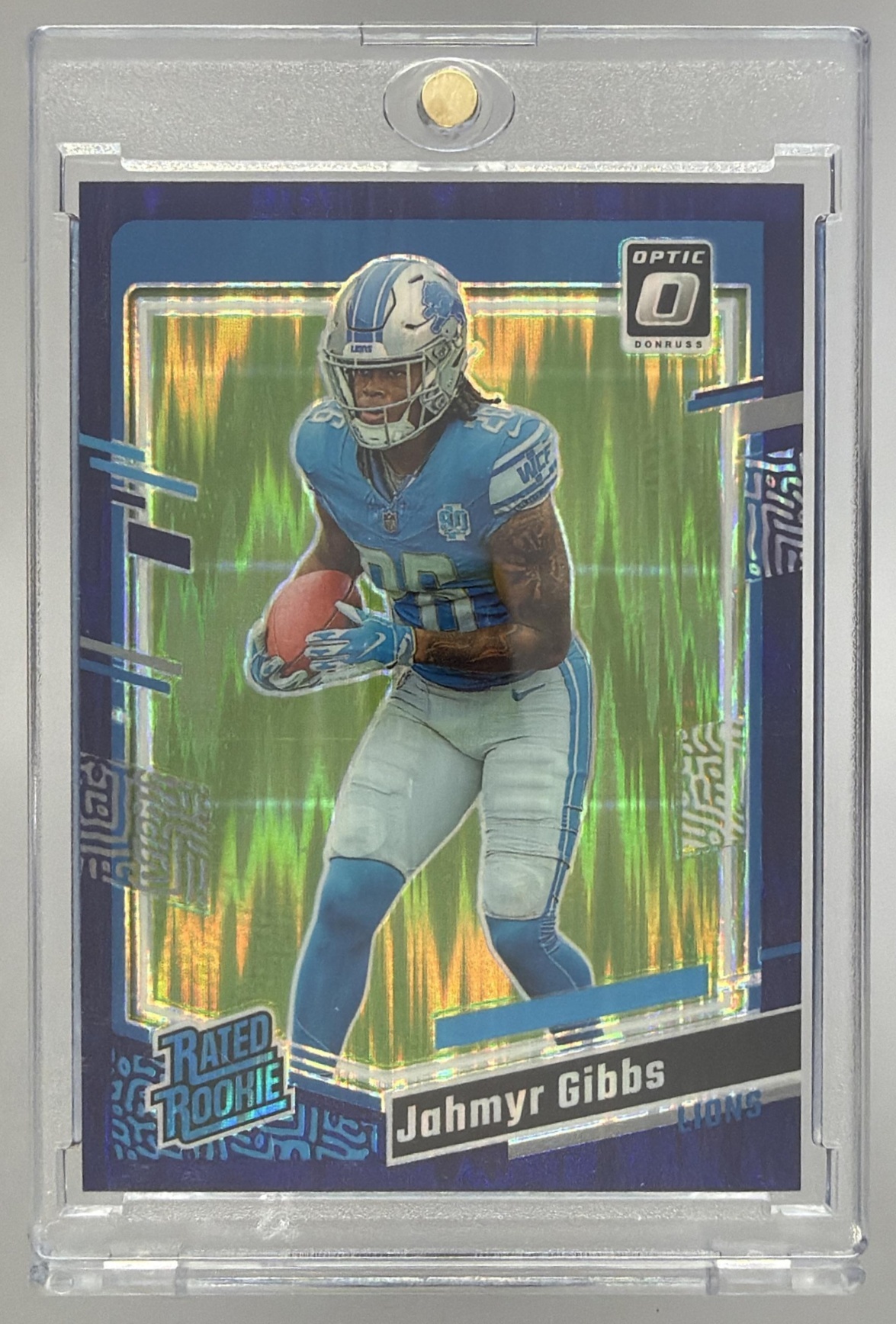 Card image for 2023 Panini Donruss Optic Jahmyr Gibbs Blue Hyper Prizm #236 RC Rated Rookie Lions