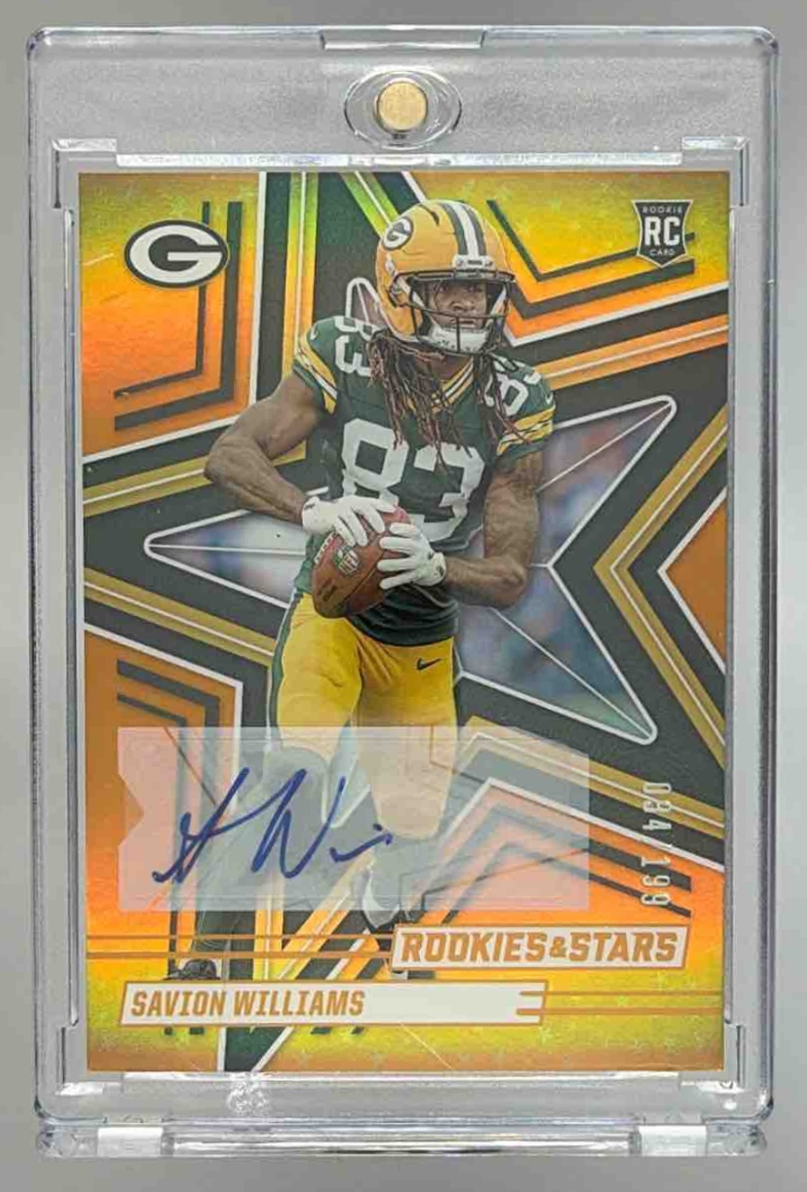 Card image for 2025 Panini Rookies & Stars Savion Williams Signatures Orange /199 #174 RC Auto Packers