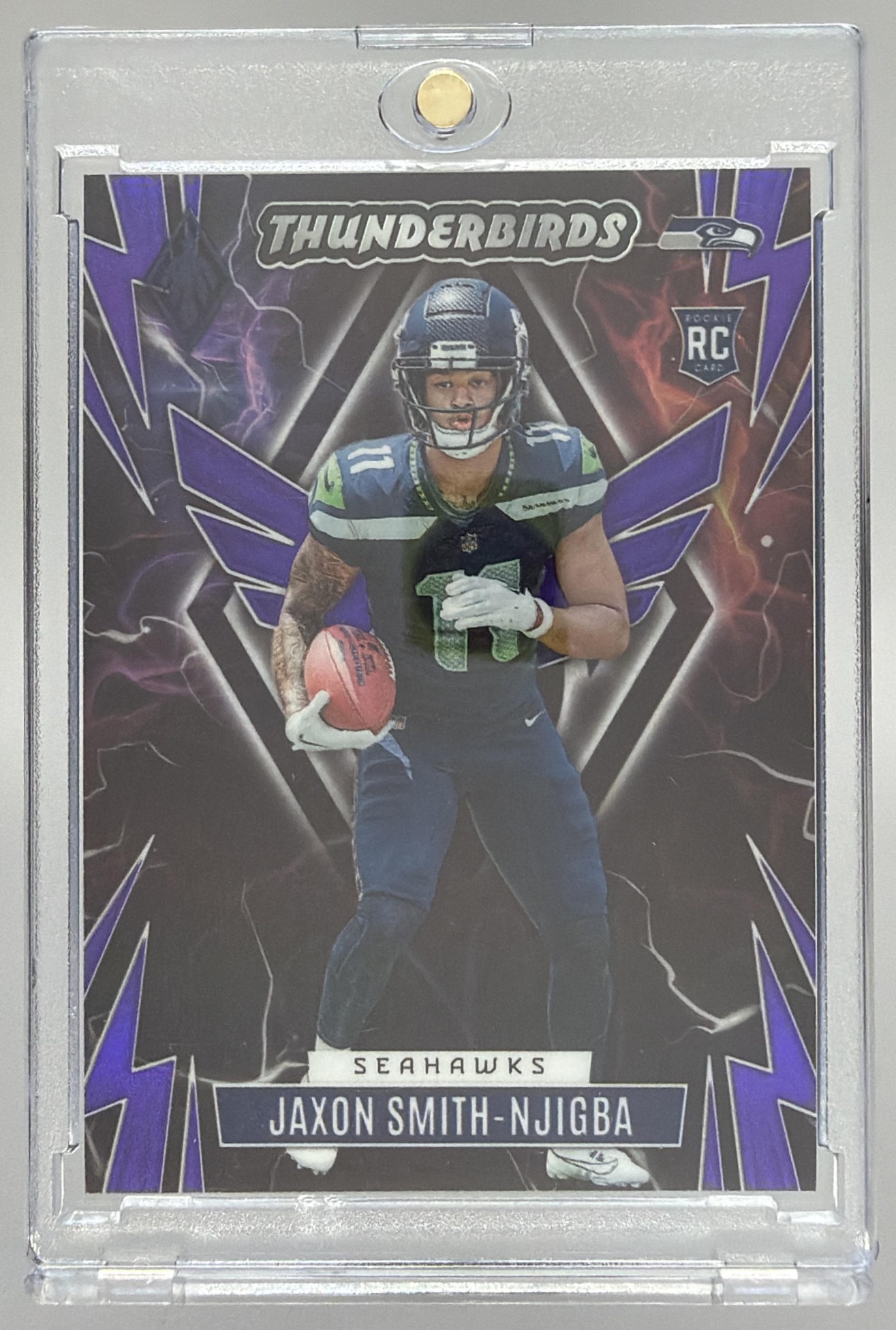 Card image for 2023 Panini Phoenix Jaxon Smith-Njigba Thunderbirds Purple /99 #TB-JSN RC Seahawks