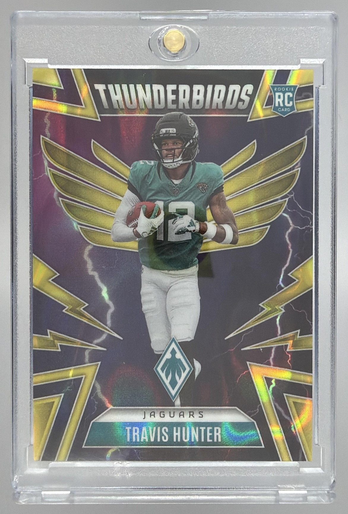 Card image for 2025 Panini Phoenix Travis Hunter Thunderbirds Silver Seismic Prizm /99 #22 RC Jaguars