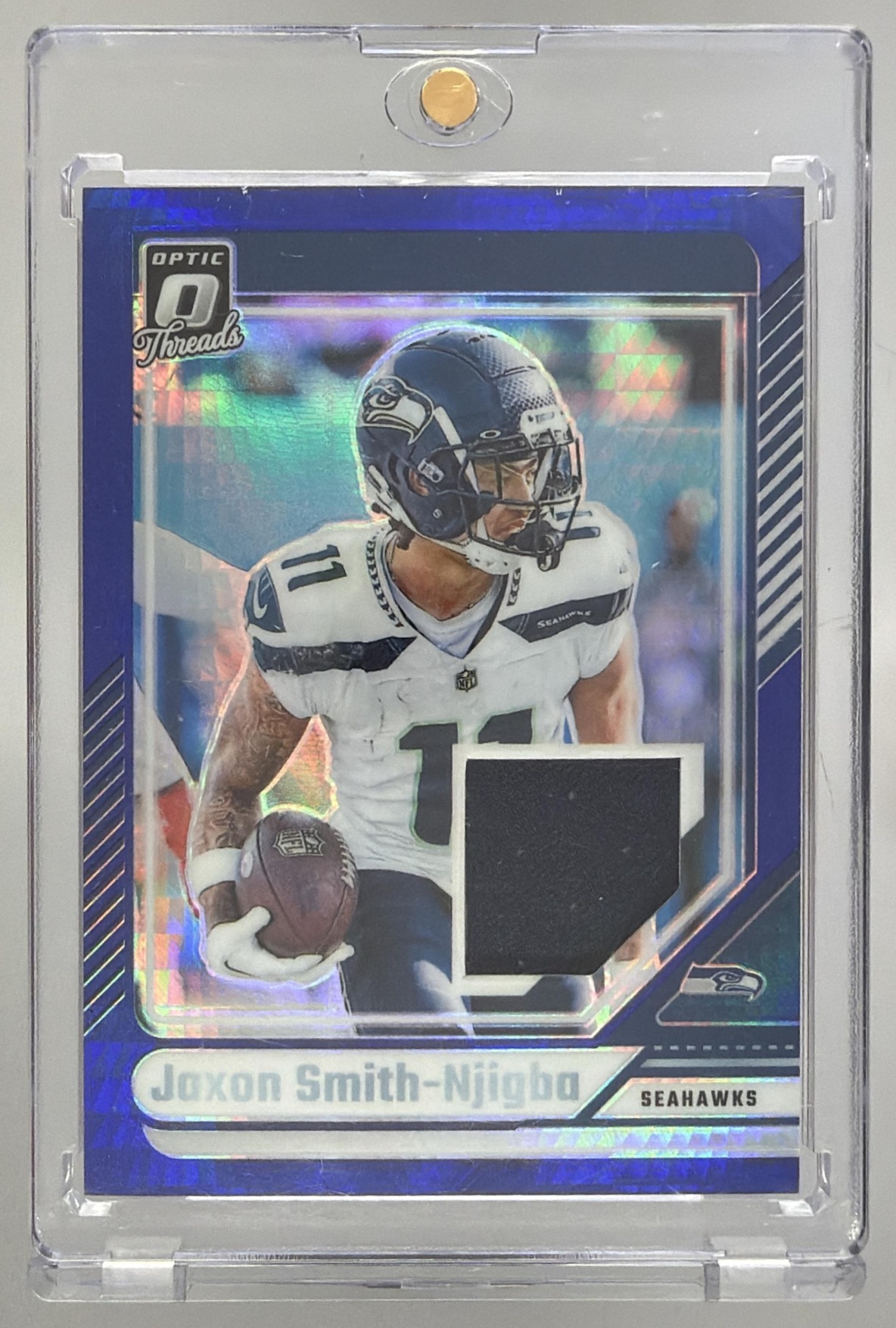 Card image for 2024 Panini Donruss Optic Jaxon Smith-Njigba Threads Blue Hyper #DTB-JSN MEM Seahawks