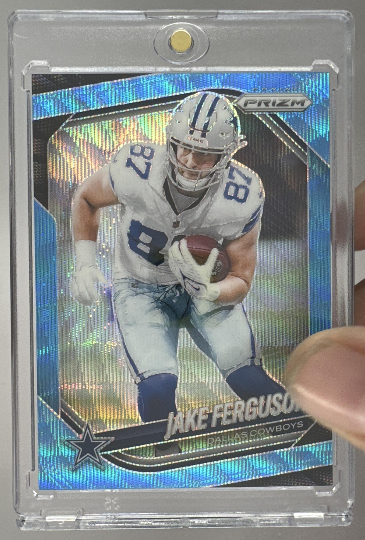 Card image for 2025 Panini Football Prizm Jake Ferguson Blue Wave /230 #36 Dallas Cowboys