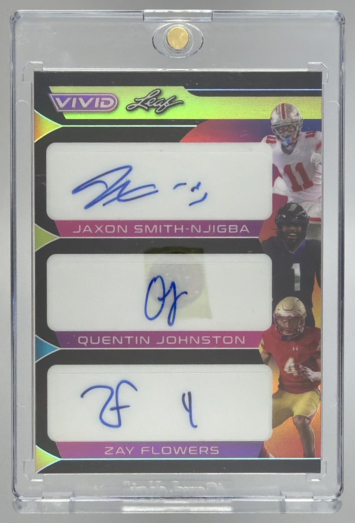 Card image for 2023 Leaf Vivid Jaxon Smith-Njigba Quentin Johnston Zay Flowers Colorful Trios Auto Prismatic Black /5 #CT-23