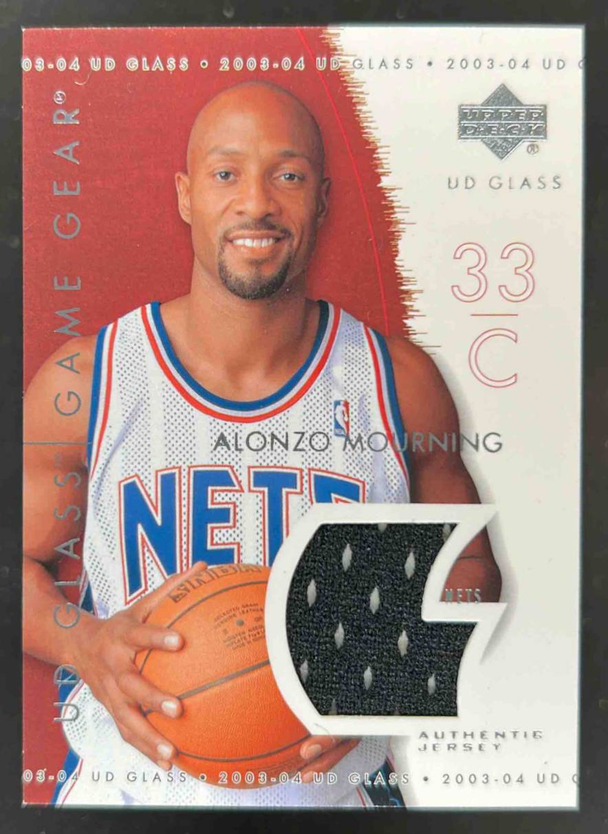 Card image for 2003-04 UPPER DECK GLASS ALONZO MOURNING #GG-AM GAME GEAR MEM NEW JERSEY NETS
