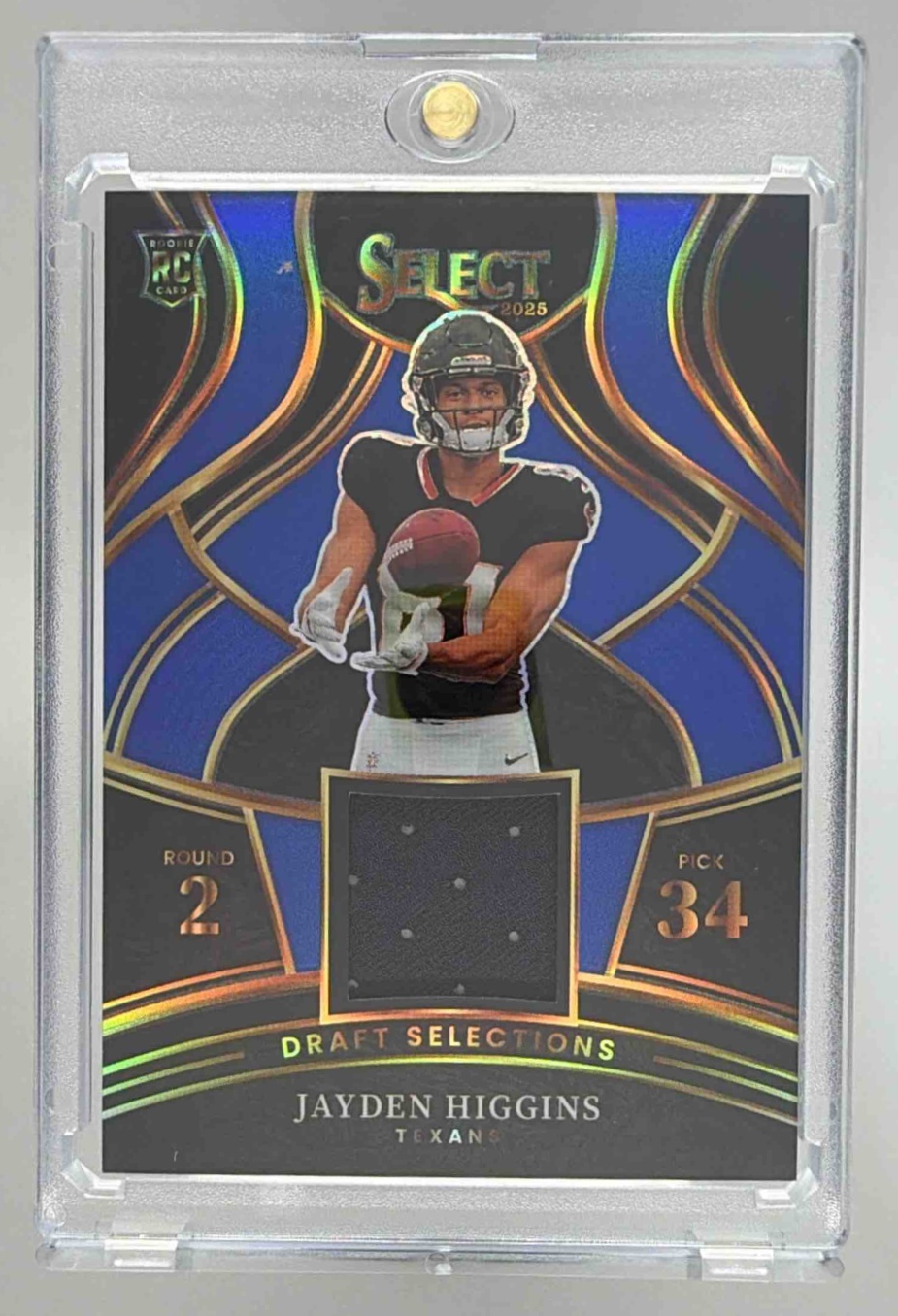 Card image for 2025 Panini Select Jayden Higgins Draft Selections Memorabilia Blue Prizm #DSM-JHS MEM RC Texans