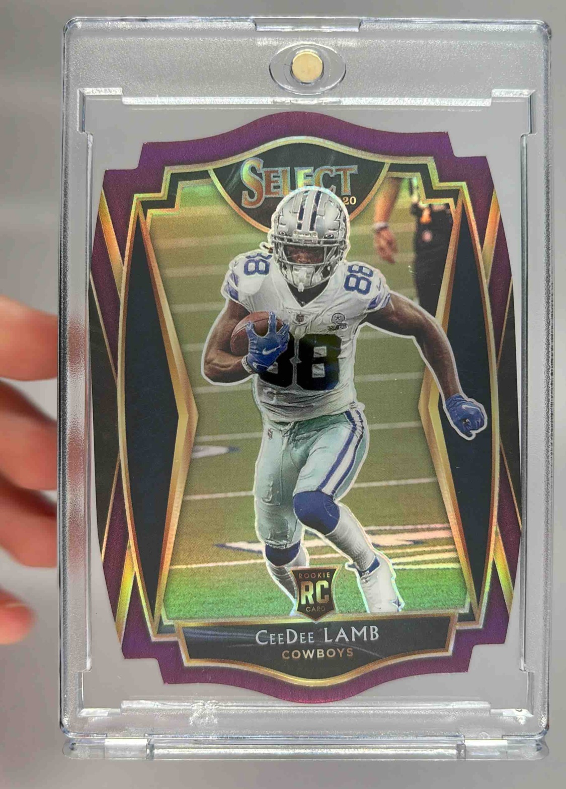 Card image for 2020 Panini Select CeeDee Lamb Purple Prizm Die Cut #157 RC Premier Cowboys