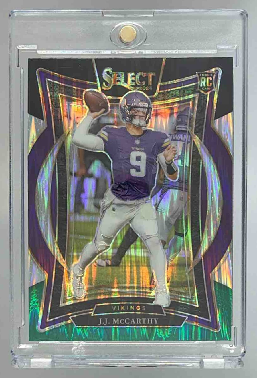 Card image for 2024 Panini Select J.J. McCarthy Concourse Green and Yellow Prizm Shock #24 RC Vikings