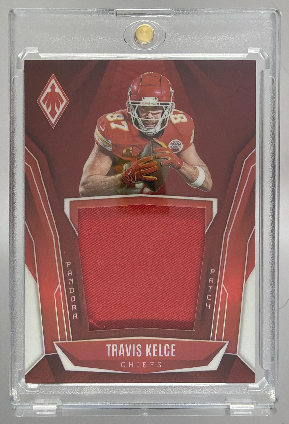 Card image for 2025 Panini Phoenix Travis Kelce Pandora Patch Red Prizm /249 #PAP-TKE MEM Chiefs