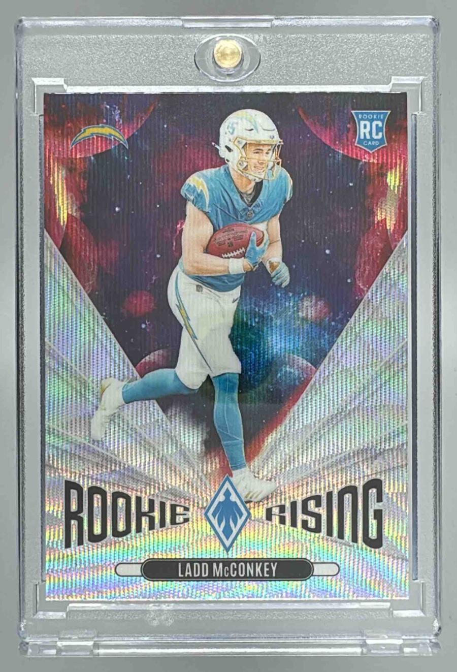 Card image for 2024 Panini Phoenix Ladd McConkey Rookie Rising #RR-LMY RC Chargers