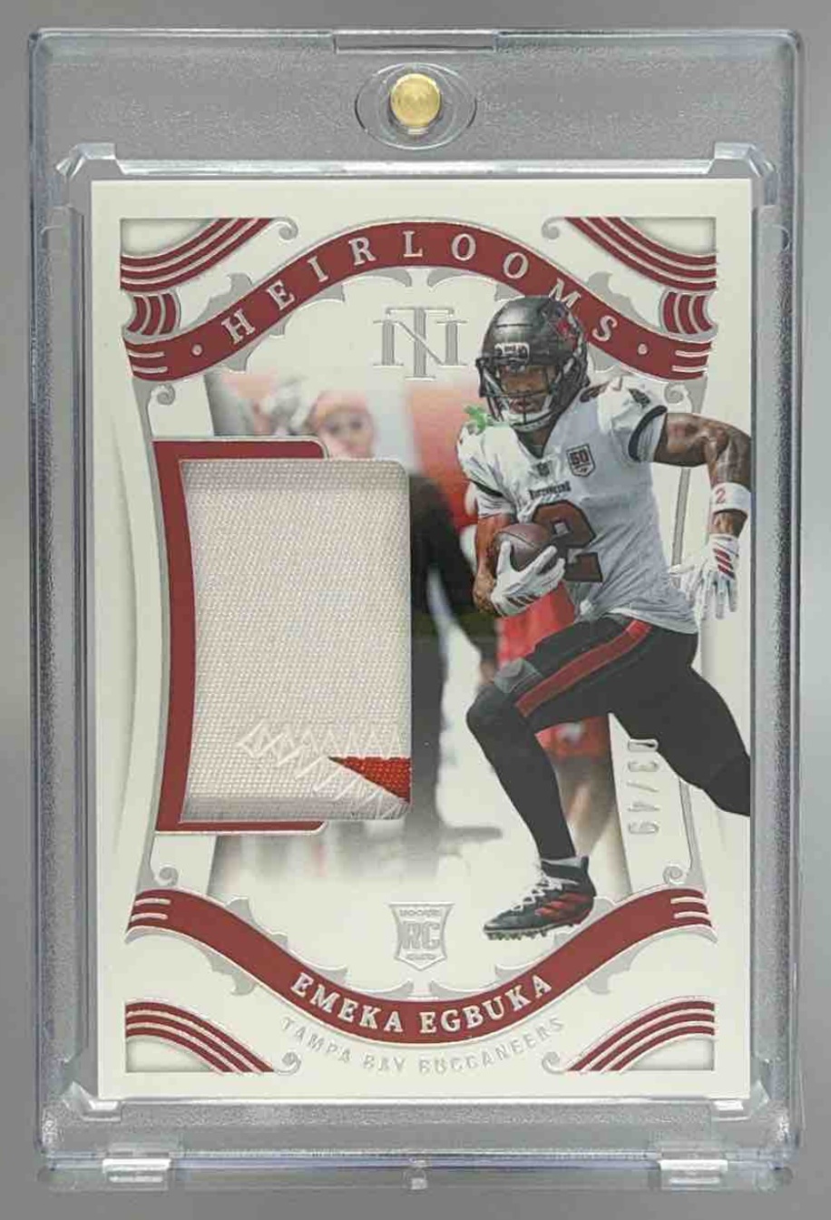 Card image for 2025 Panini National Treasures Emeka Egbuka Heirlooms /49 #H-EEA MEM RC Buccaneers