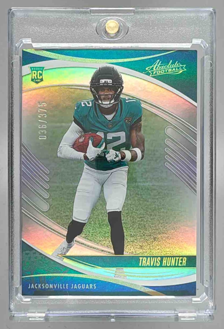 Card image for 2025 Panini Absolute Travis Hunter Rookies Spectrum /375 #186 RC Jaguars