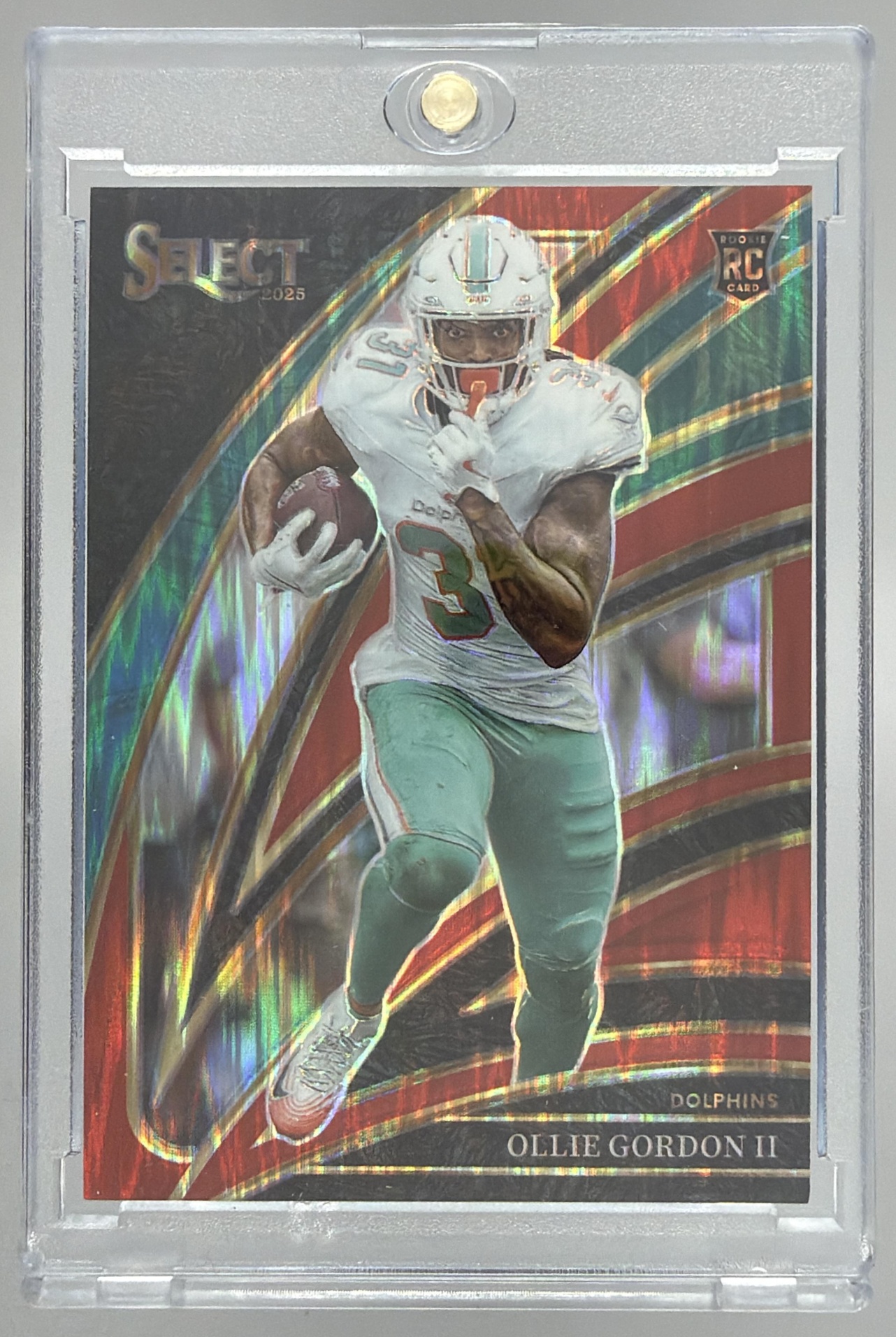Card image for 2025 Panini Select Ollie Gordon II Club Level Red Prizm Shock /249 #281 RC Dolphins